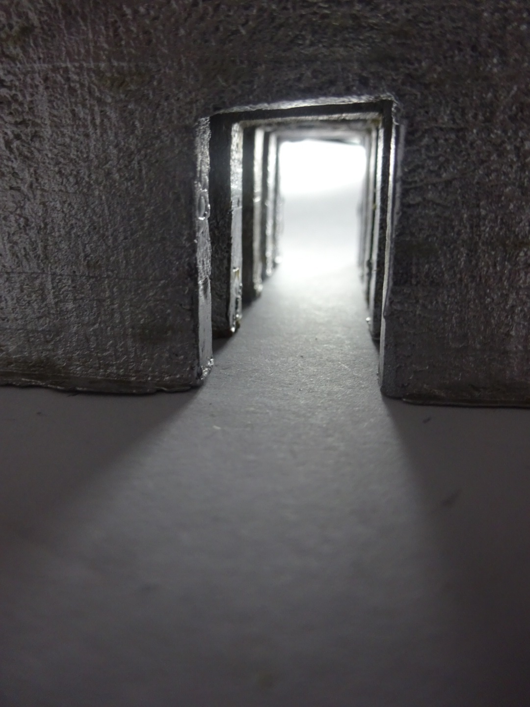 Light passing through four doorways that align 