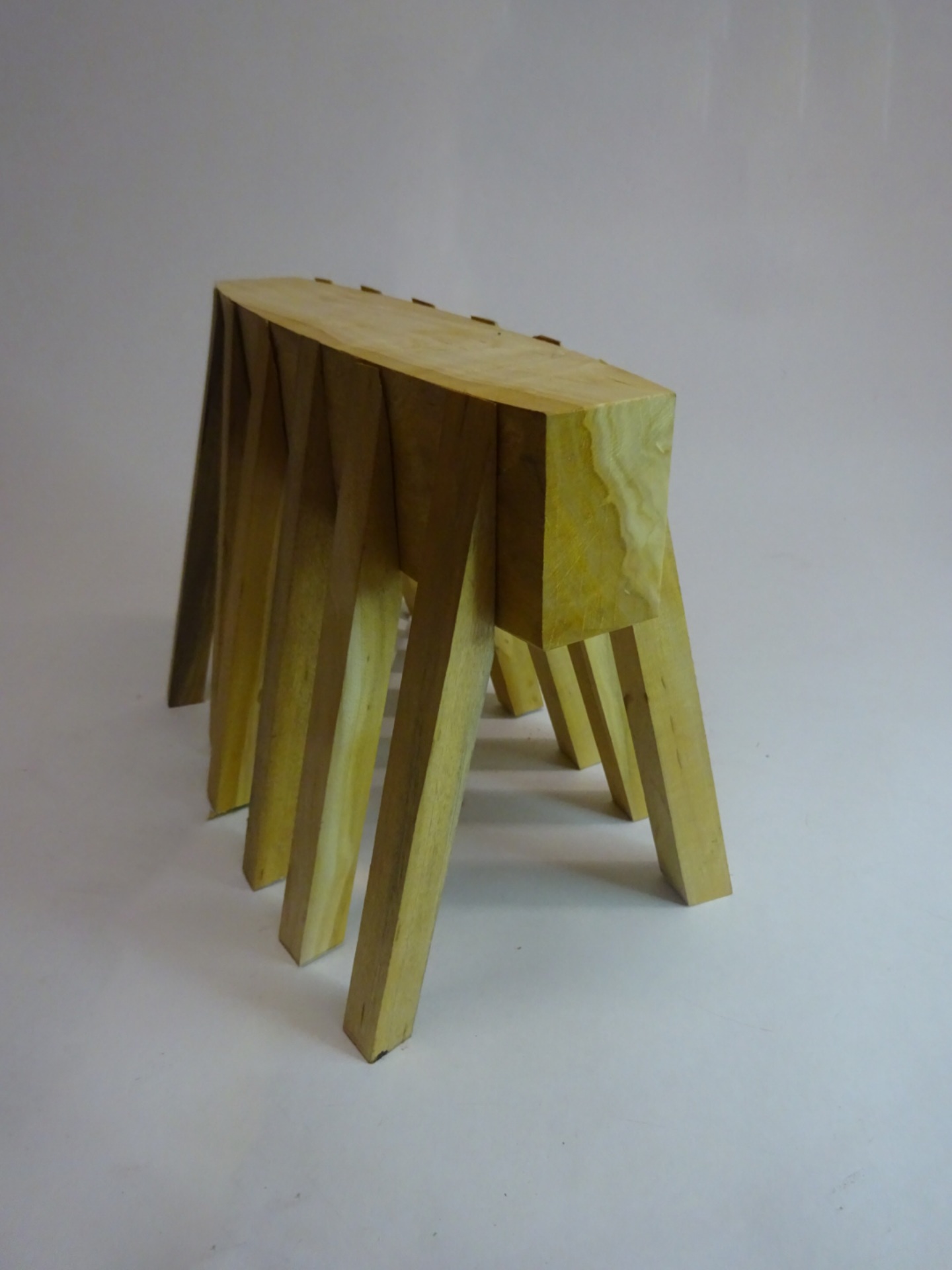 many legged curved mass standing like and insect or upturned boat.