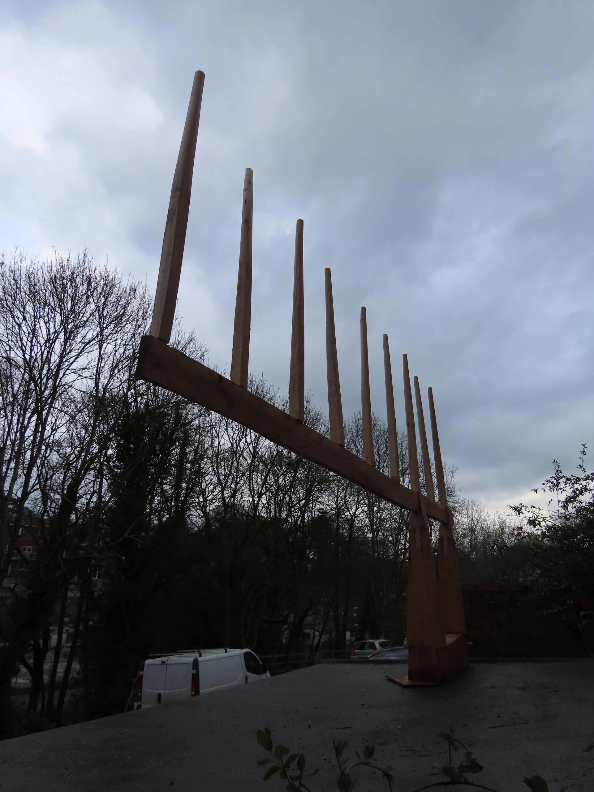 A heavily tined lop-sided sculpture looming over the photographer.