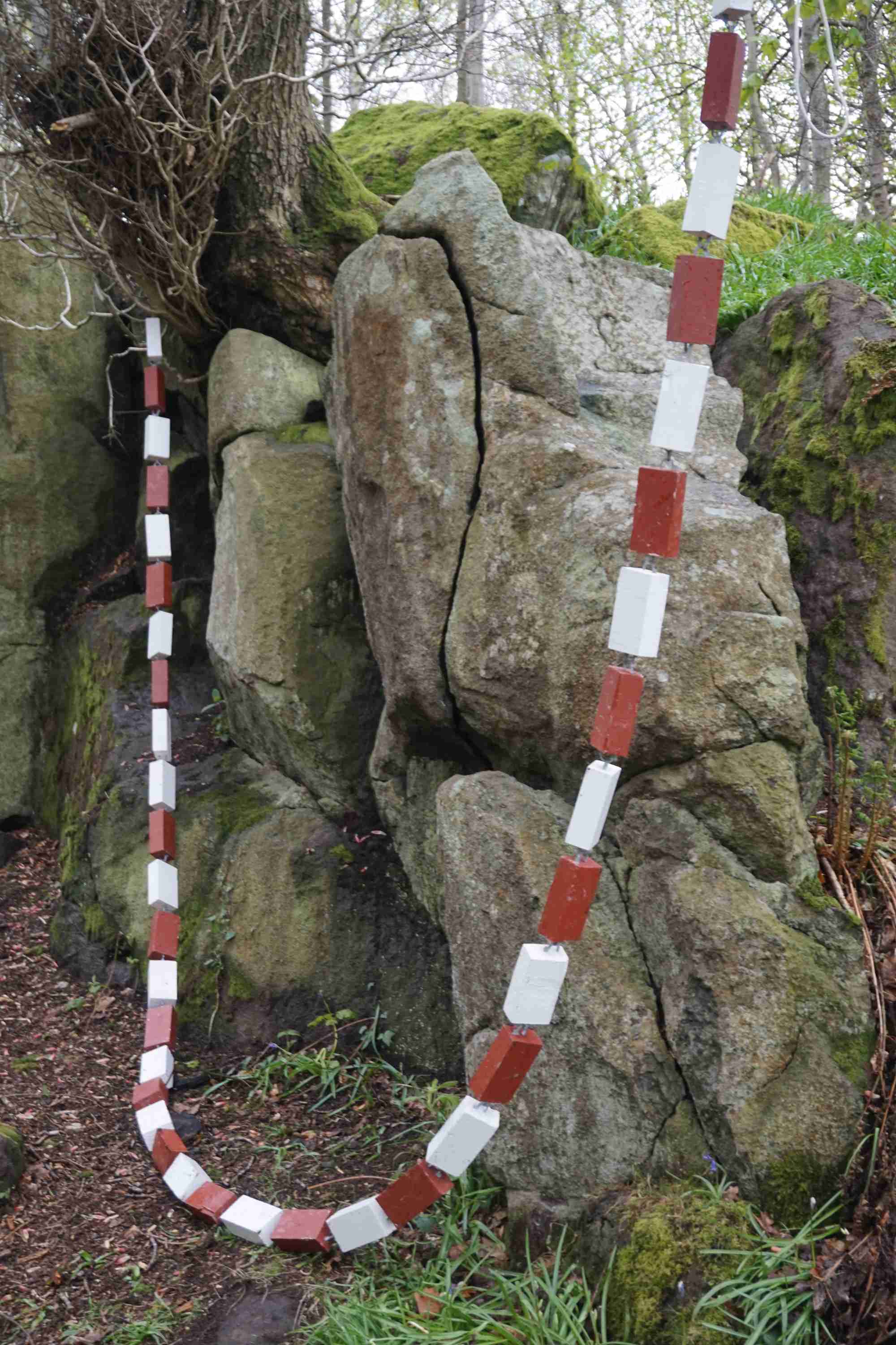 Red and White Wooden Chain drooped in a large U