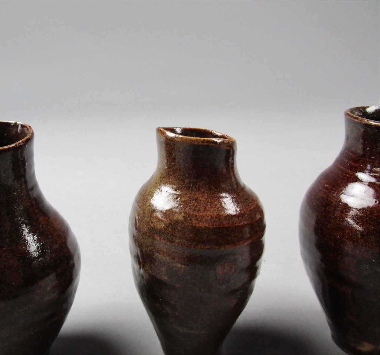 Detail of small brown glazed vases.