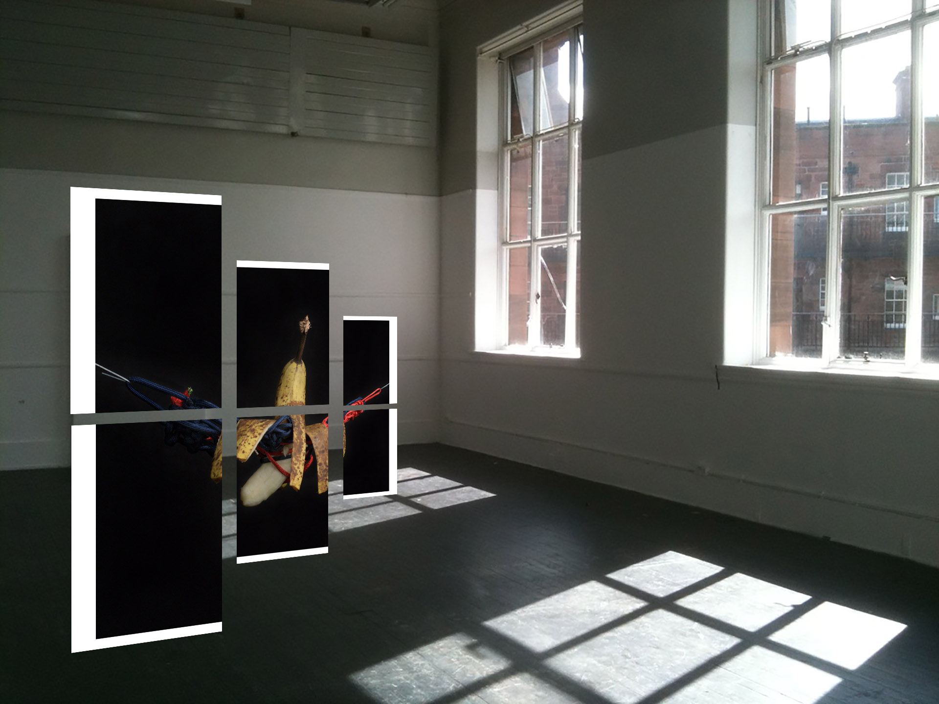 Six A3 pieces of paper creating one full image together, suspended in mid-air within a white-walled room.