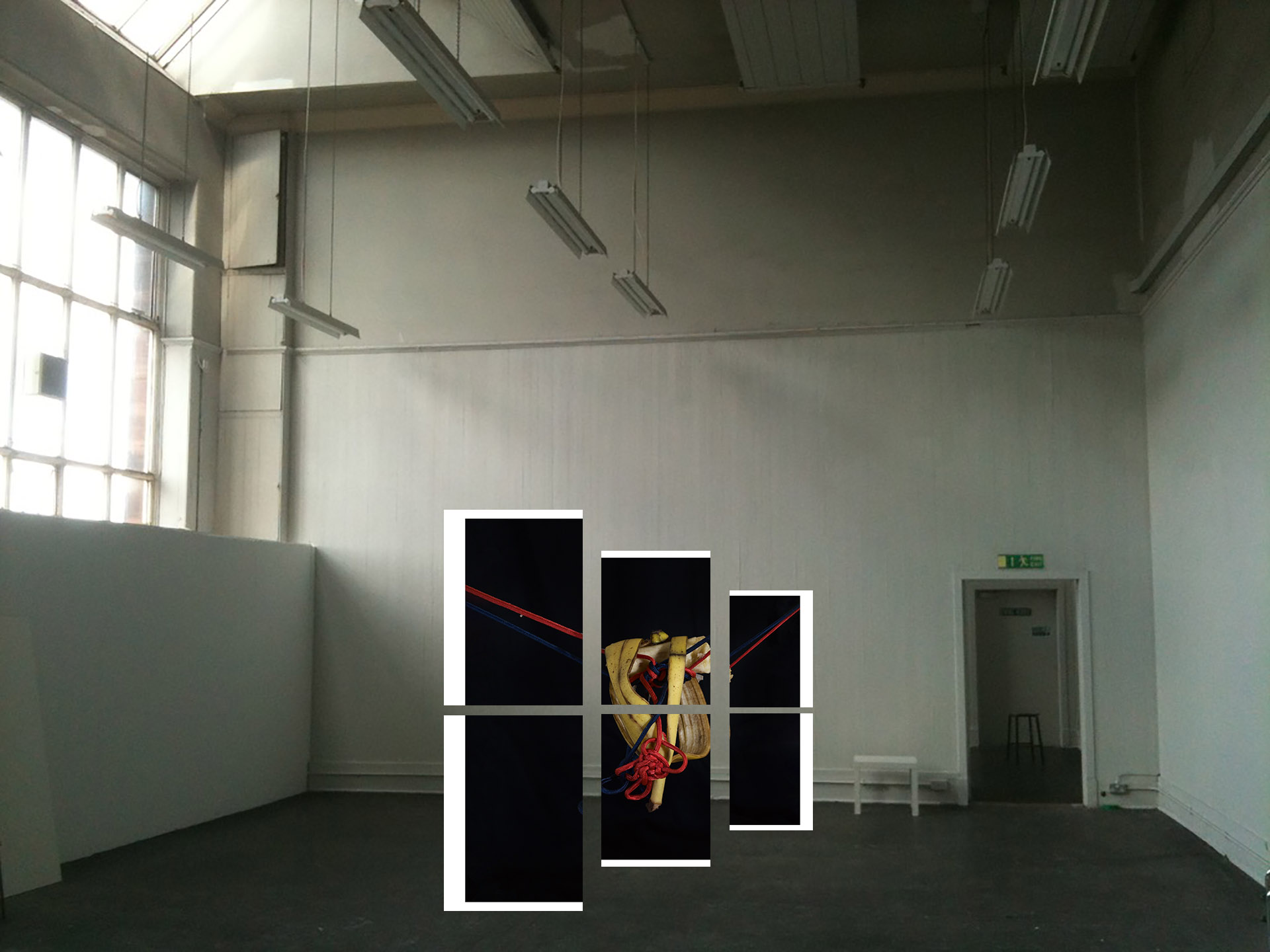 Six A3 pieces of paper creating one full image together, suspended in mid-air within a white-walled room.