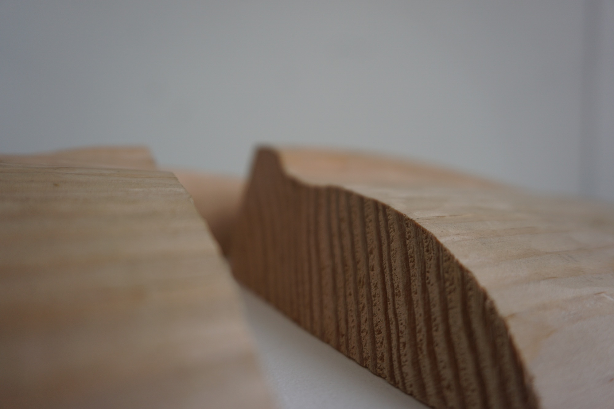 A carved wooden hill with a large section quarried away.