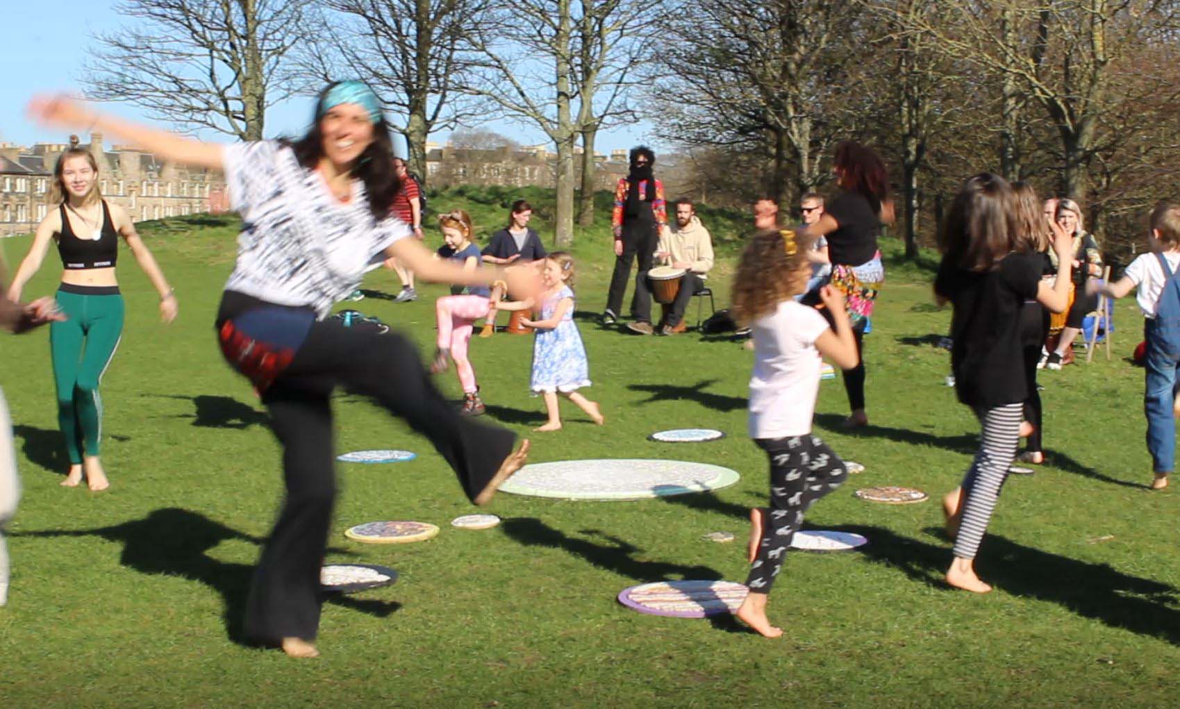 People circumambulating around the solar system in a joyful dance ritual