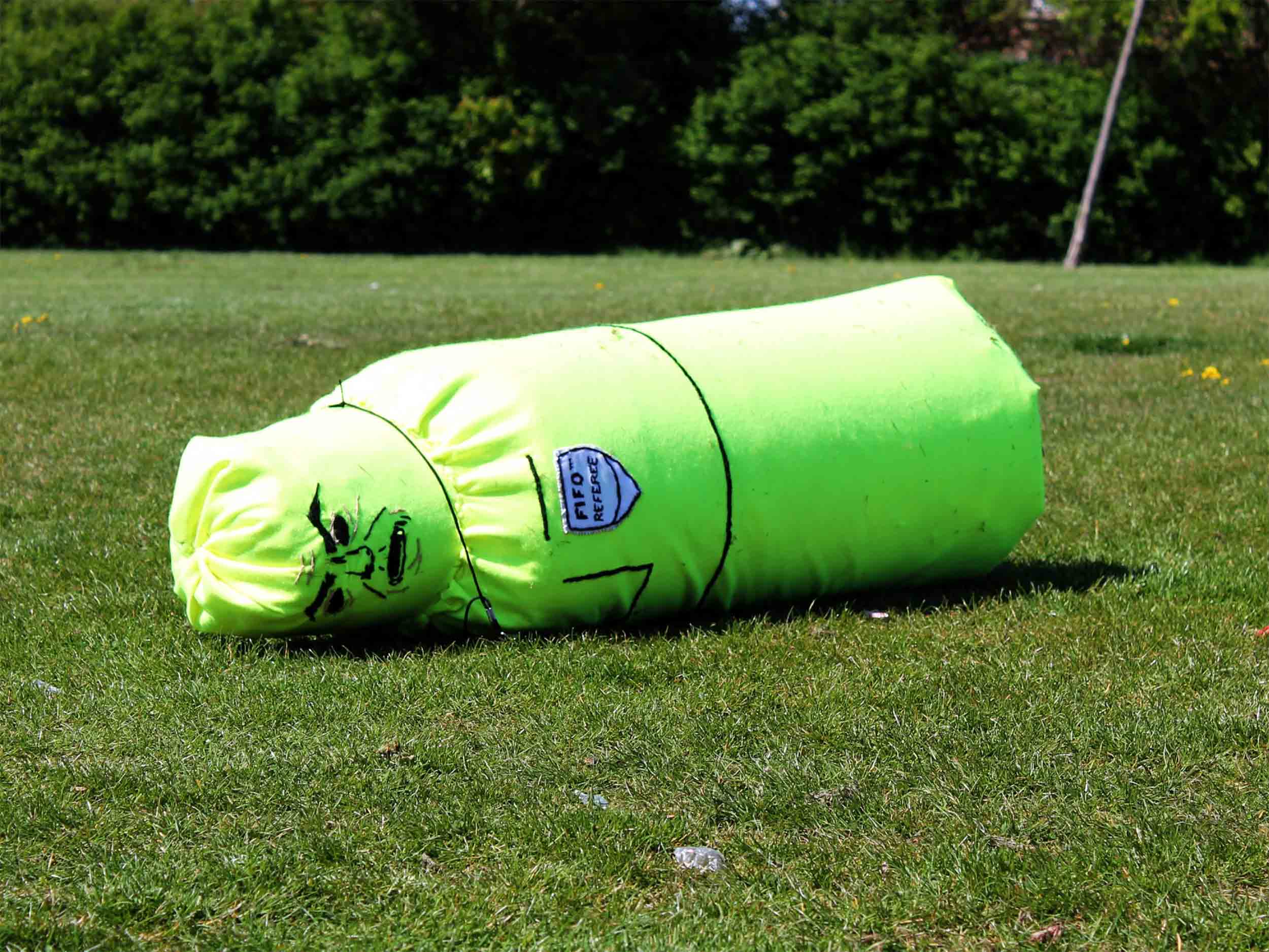 Soft Sculpture of Referee fallen to the ground