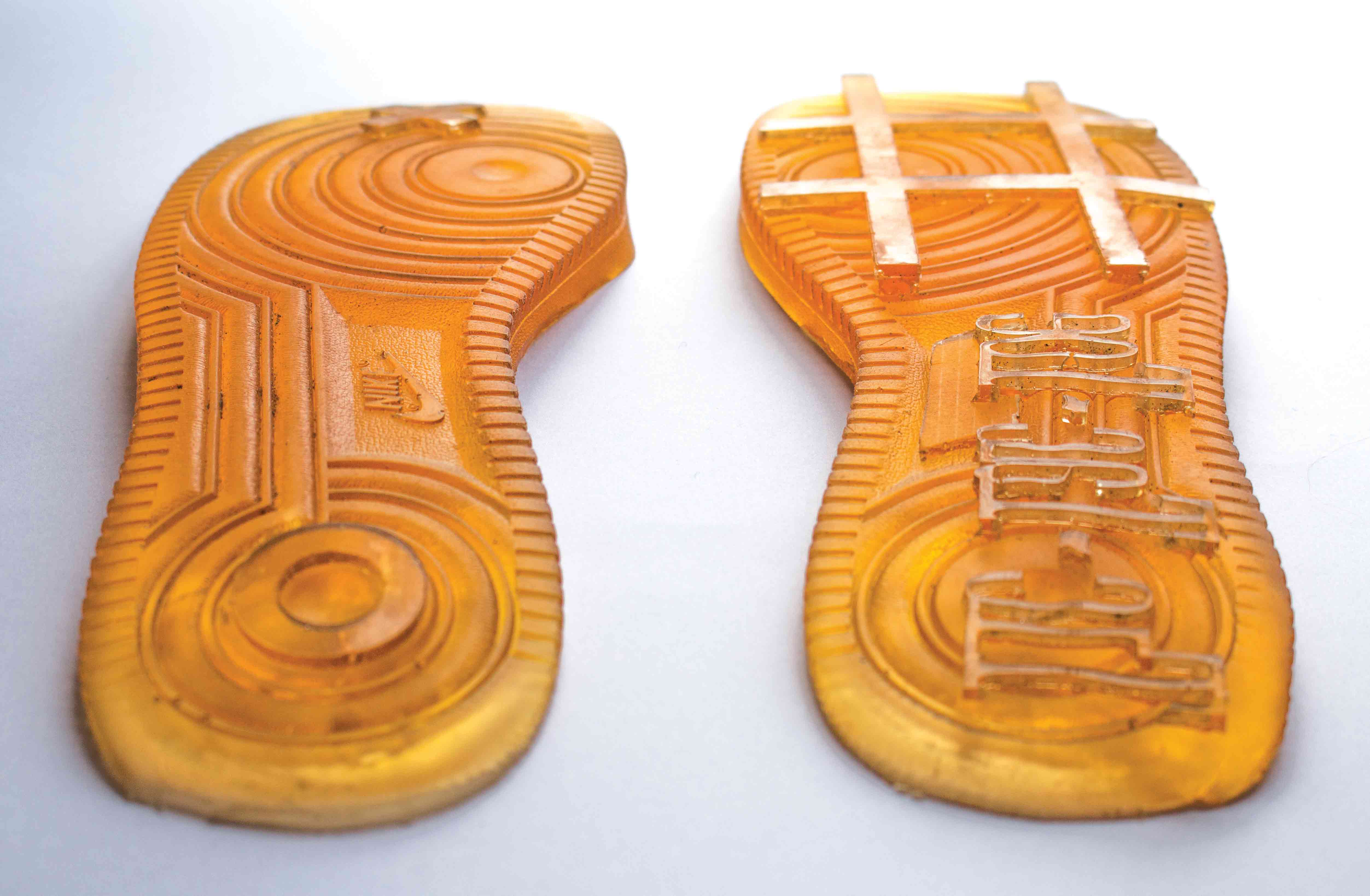Rubber shoe soles with noughts and crosses on.