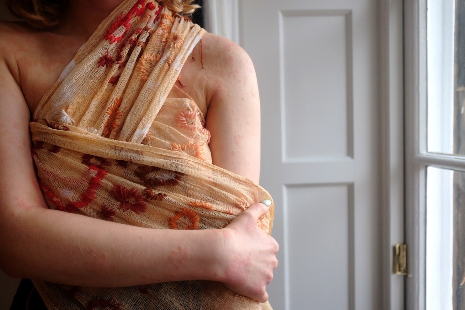 Embroidered cheese cloth dipped in latex