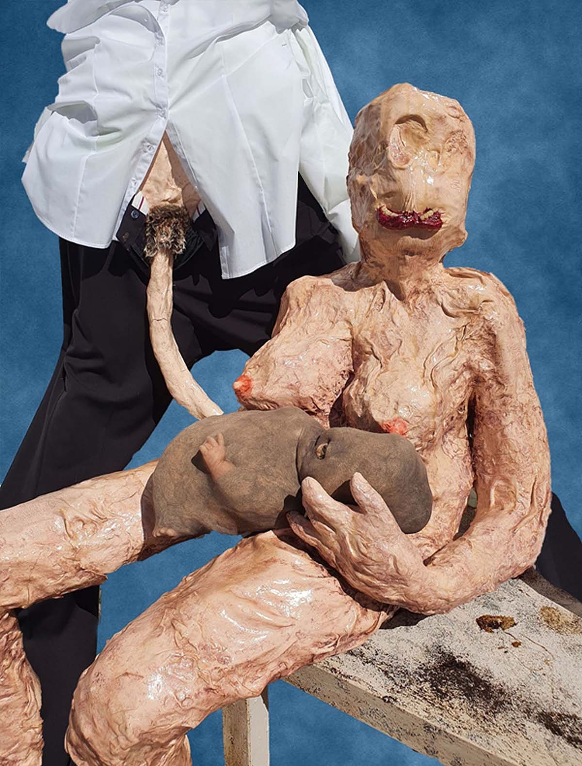 Naked nuclear family sculptures set up as a family photograph