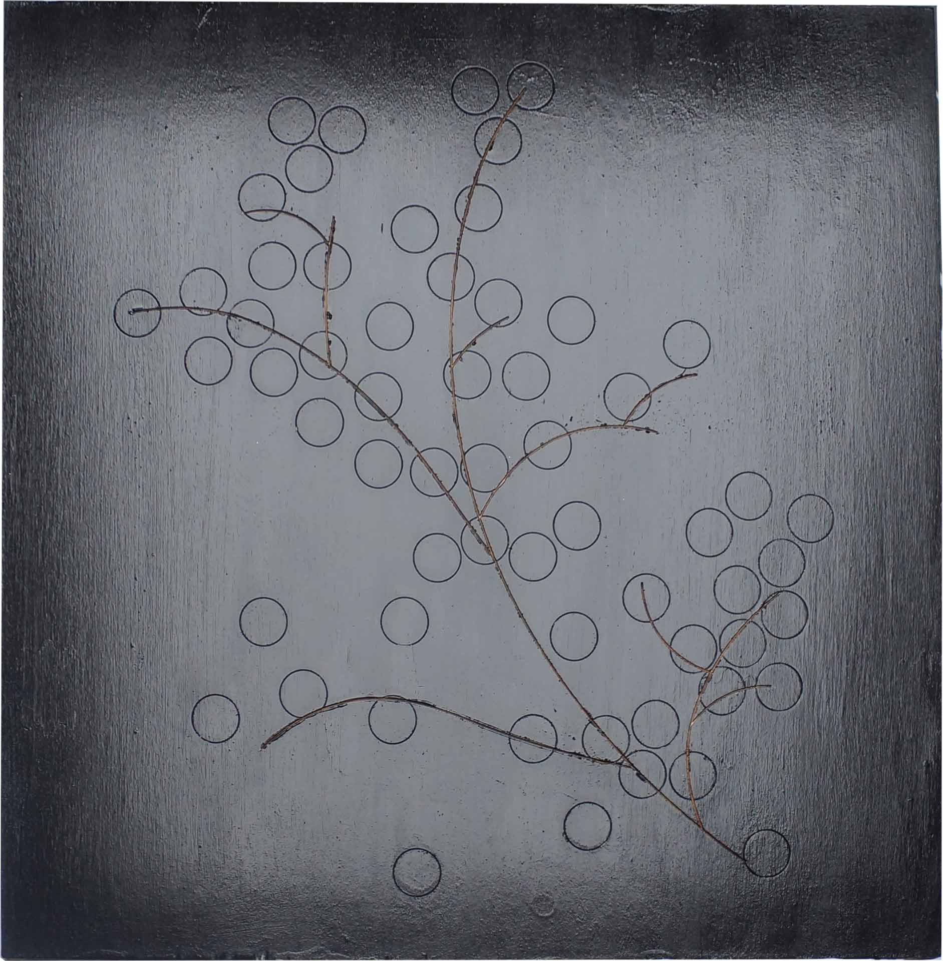 Square black painting with a thin branch carved into the surface. Many small circles are also visible on the surface of the painting, although they are not as definitively carved.