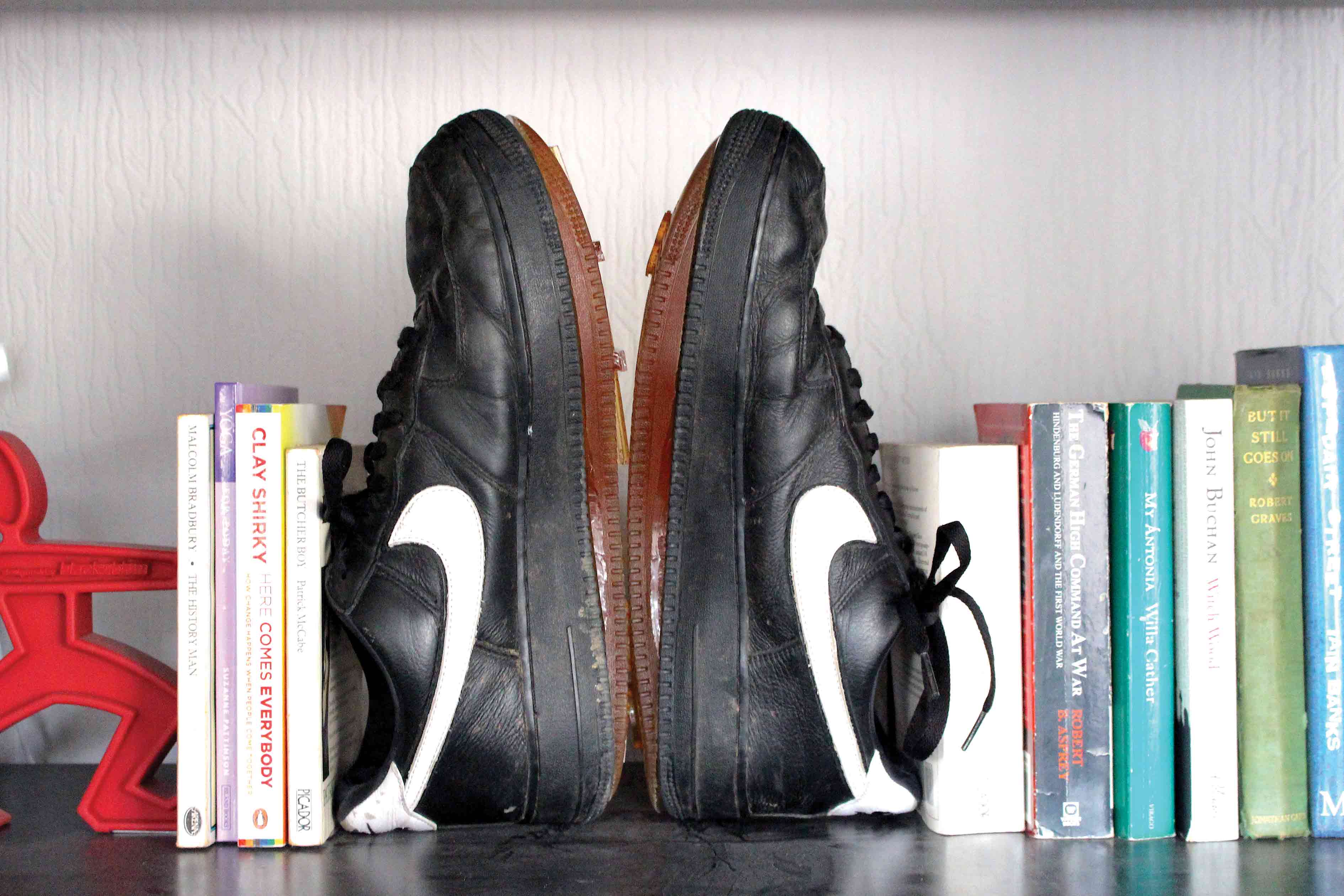 shoes on bookshelf