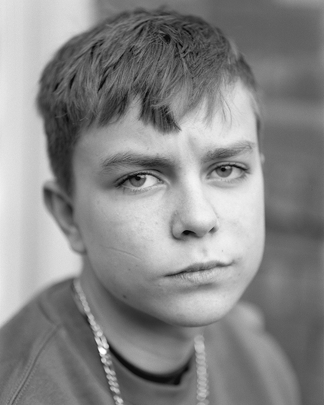 Portrait of a young boy in black and white