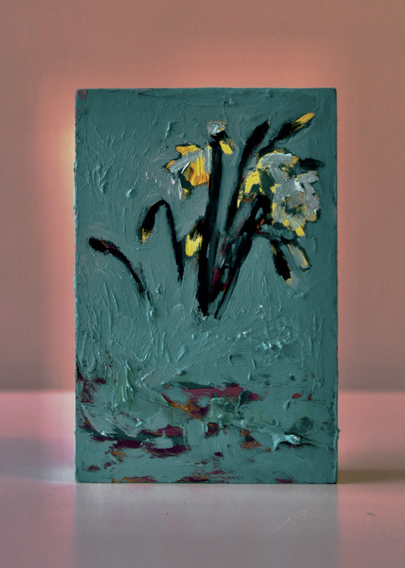 blue oil painted MDF block with image of daffodil buds with the vessel removed so that they are floating in mid-air.