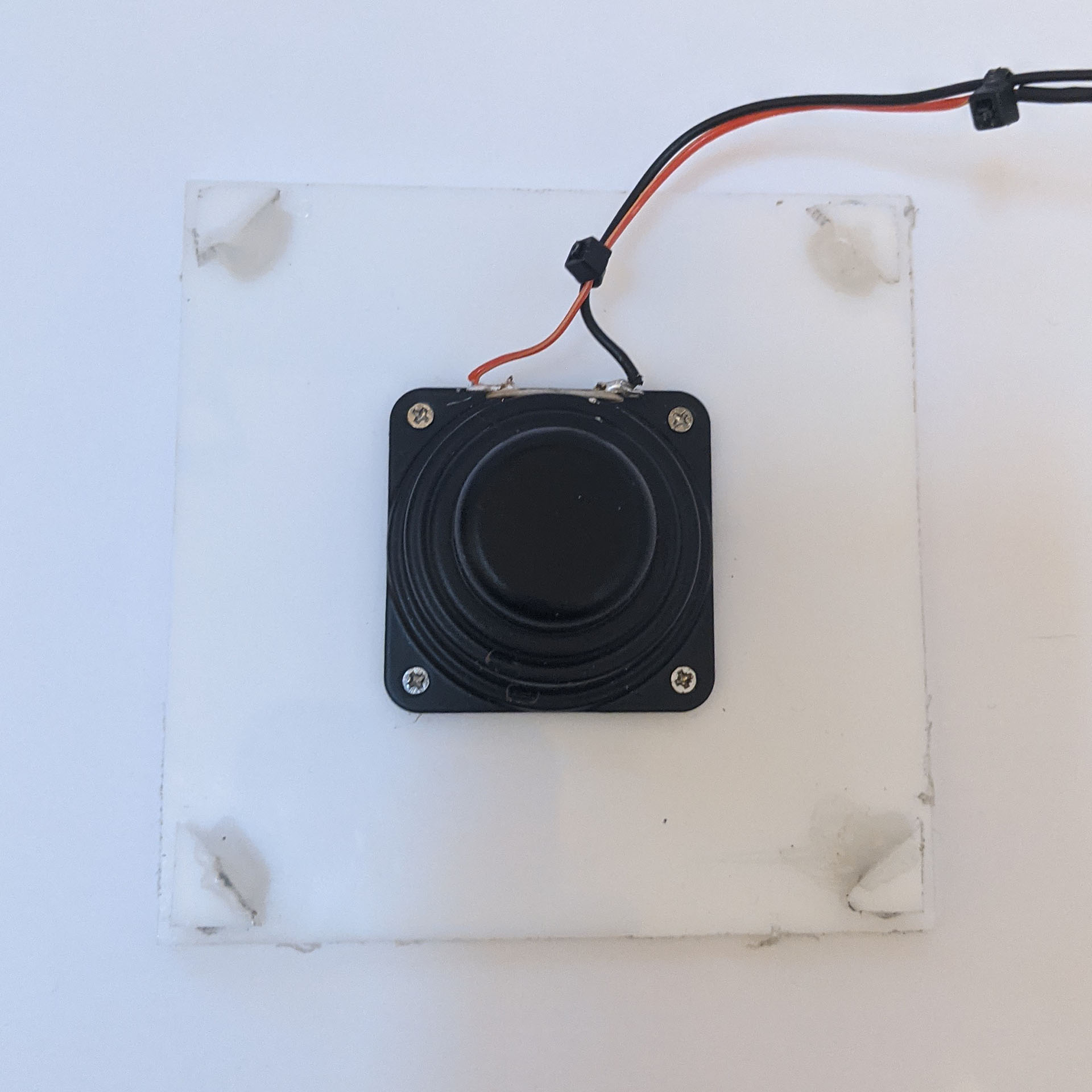 Top panel with mounted speaker