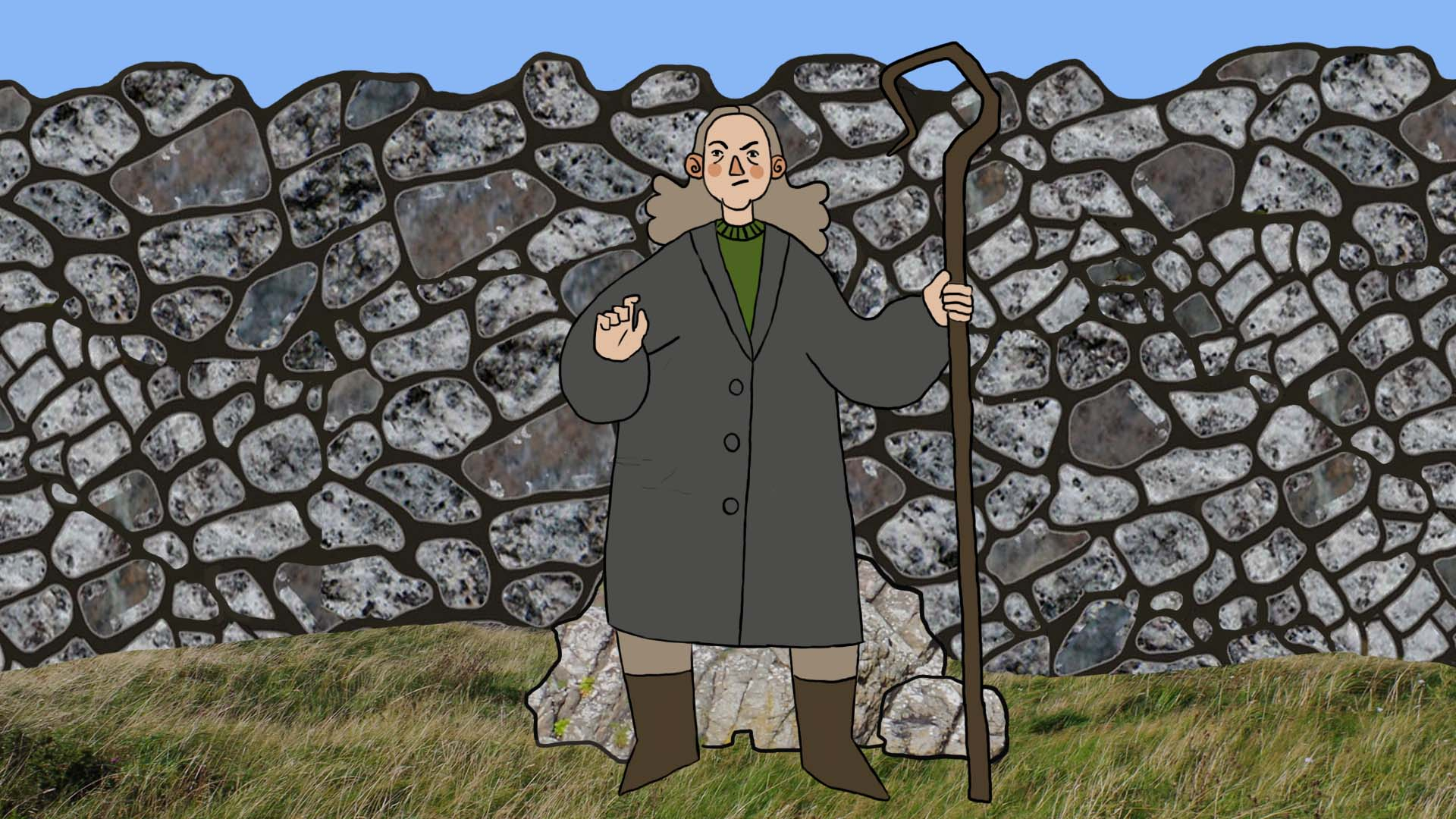 Shepherd in front of a wall