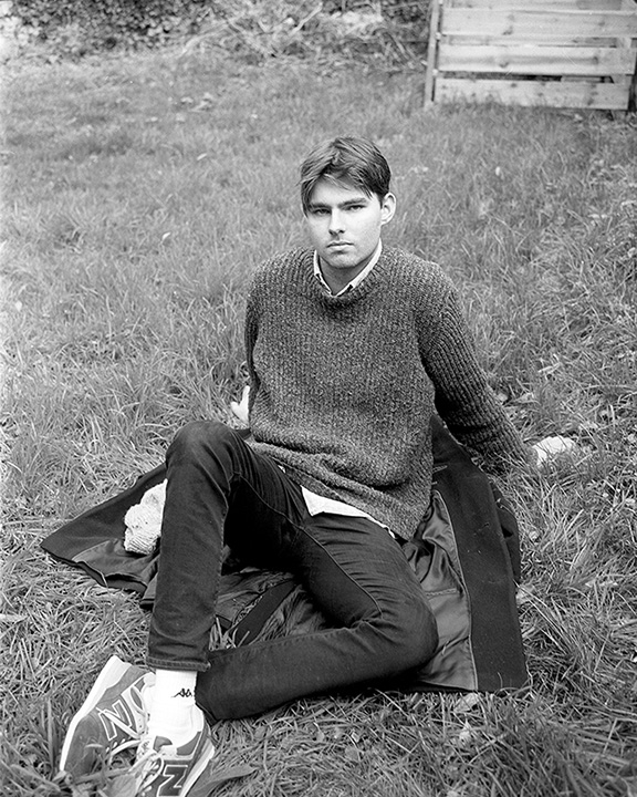 Portrait of a young man in black and white