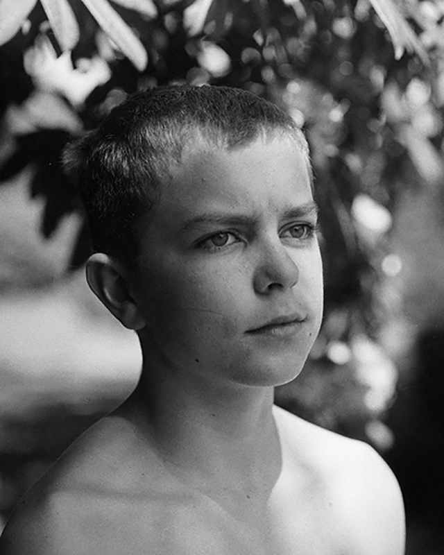 Portrait of a young boy in black and white
