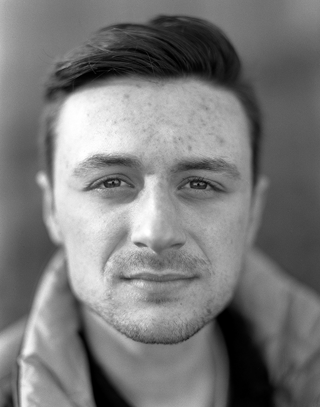 Portrait of a young man in black and white