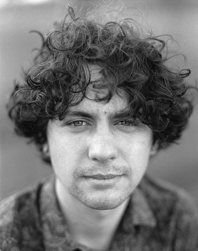 Portrait of a young man in black and white