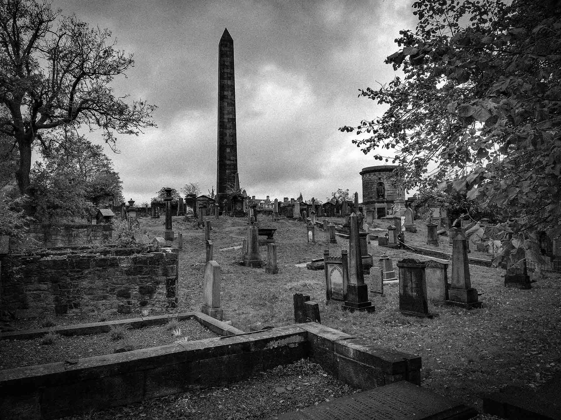 A greyscale photograph of the Old Calton Burial Ground with the Political Martyrs' Monument in the top centre