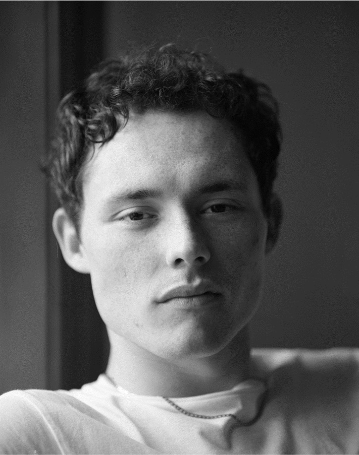 Portrait of a young man in black and white