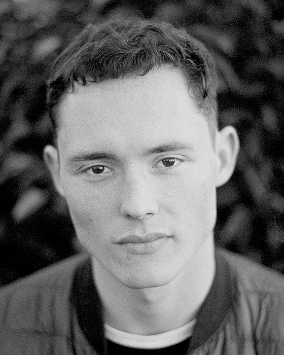 Portrait of a young man in black and white