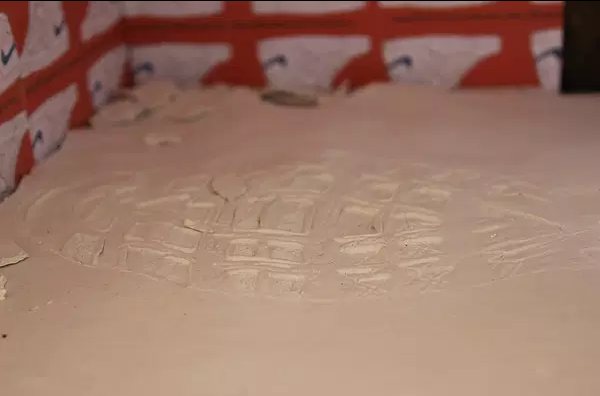 A close up of a clay footprint 