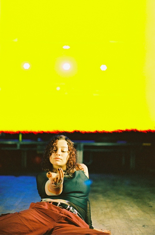 alliyah dancing under yellow light flare