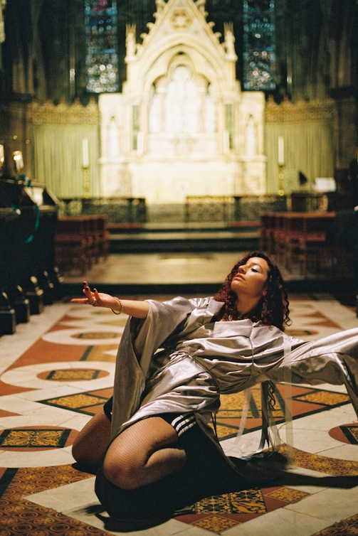 Alliyah dancing on the floor of the cathedral