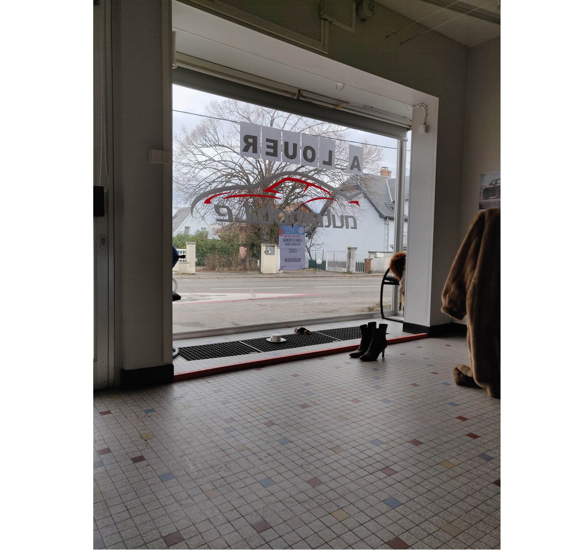 47 route de Colmar. Stills of a performed installation. France, February 2021. Trench coat.