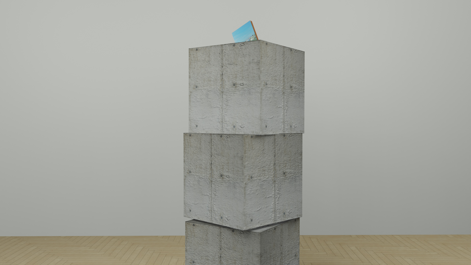 Image of three concrete blocks with a painting on top