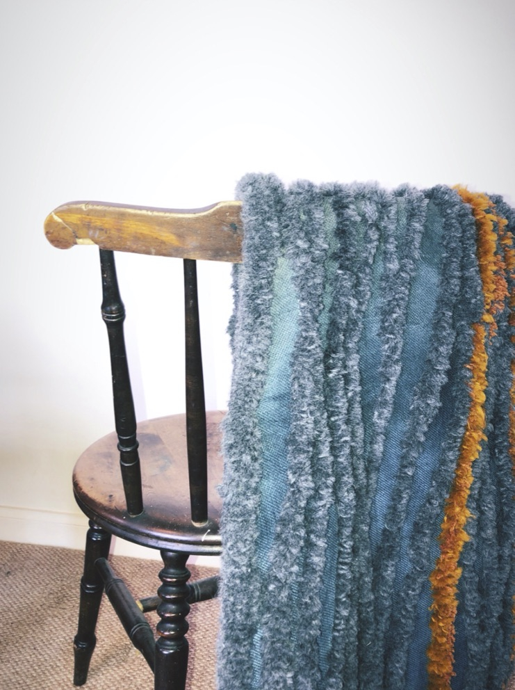 Textiles shown in an interiors setting.