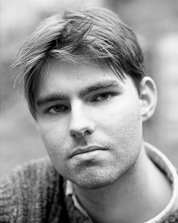 Portrait of a young man in black and white