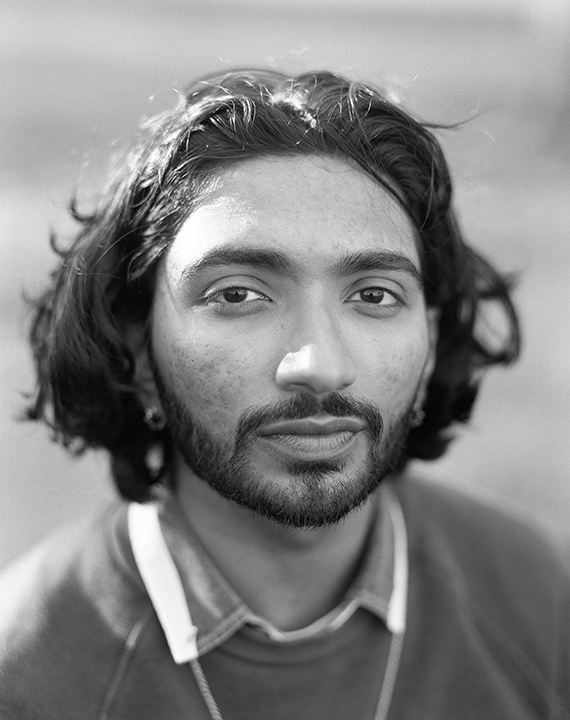 Portrait of a young man in black and white