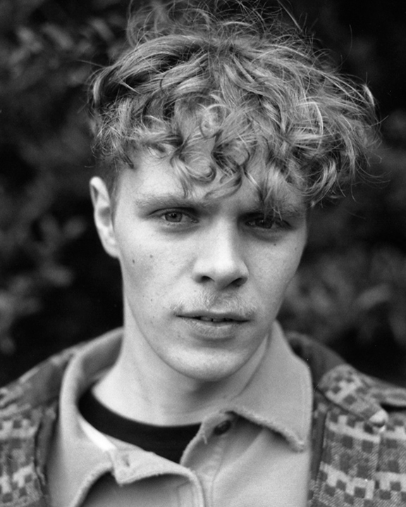Portrait of a young man in black and white