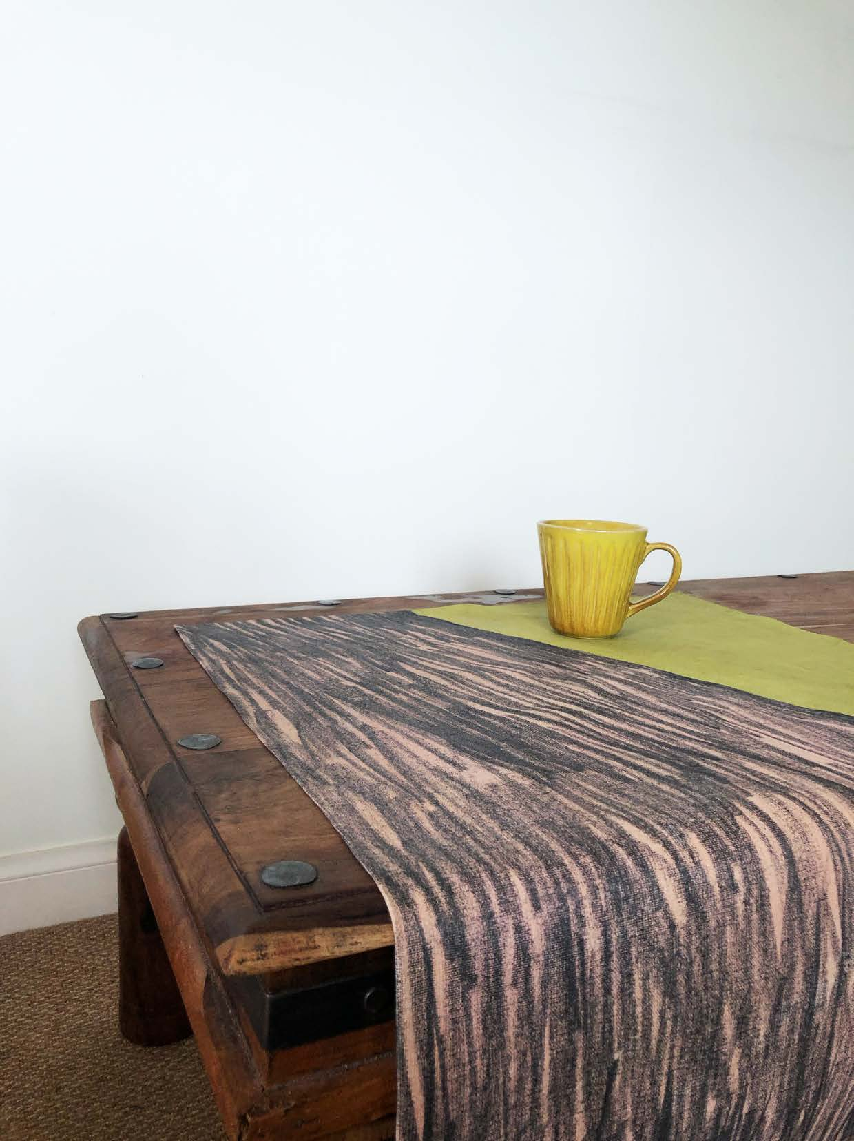 Textiles shown in an interiors setting.