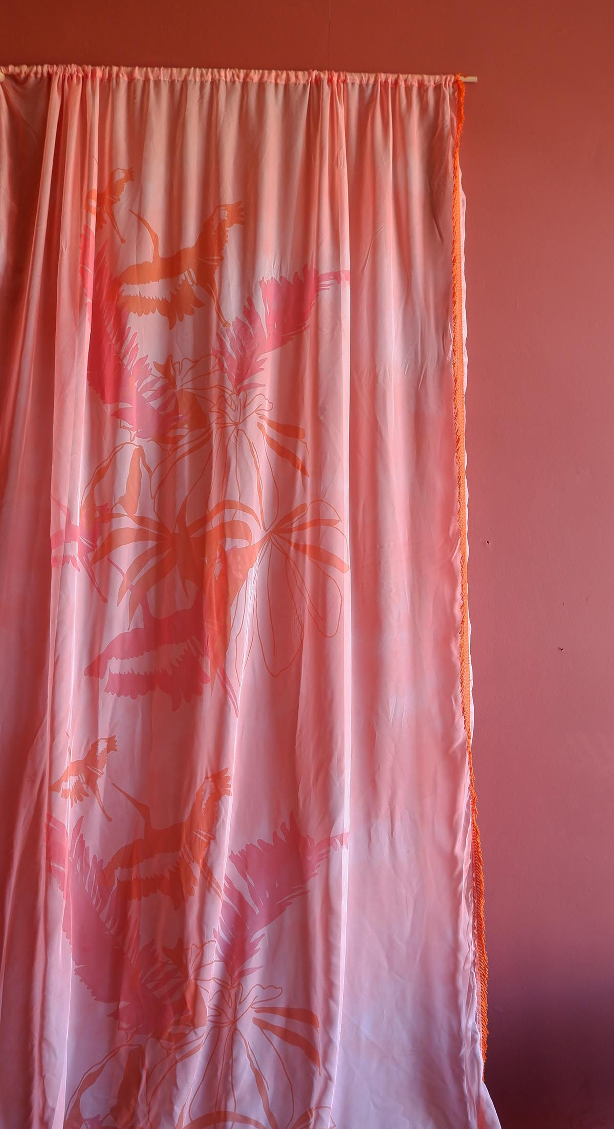 An image showing one element of my showpiece. This is a two metre length the was hand dyed and then screenprinted. The design shows flying birds and floral motifs in a linear repeat.