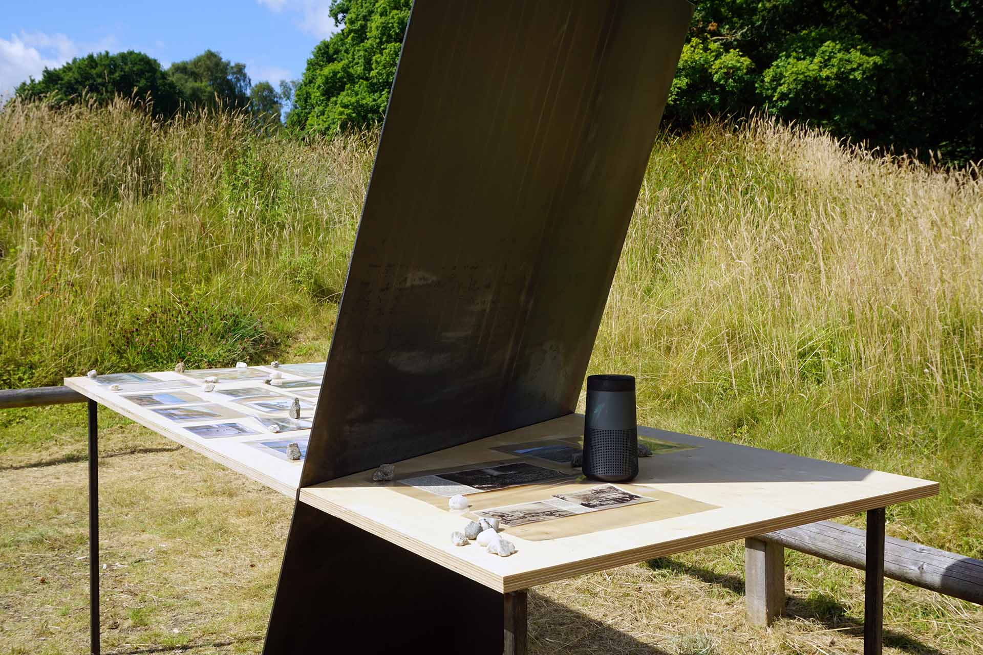 in this photo once again you can see the speaker on the table top and how the steel panel intersects with the birch ply table top it almost looks like a cross 