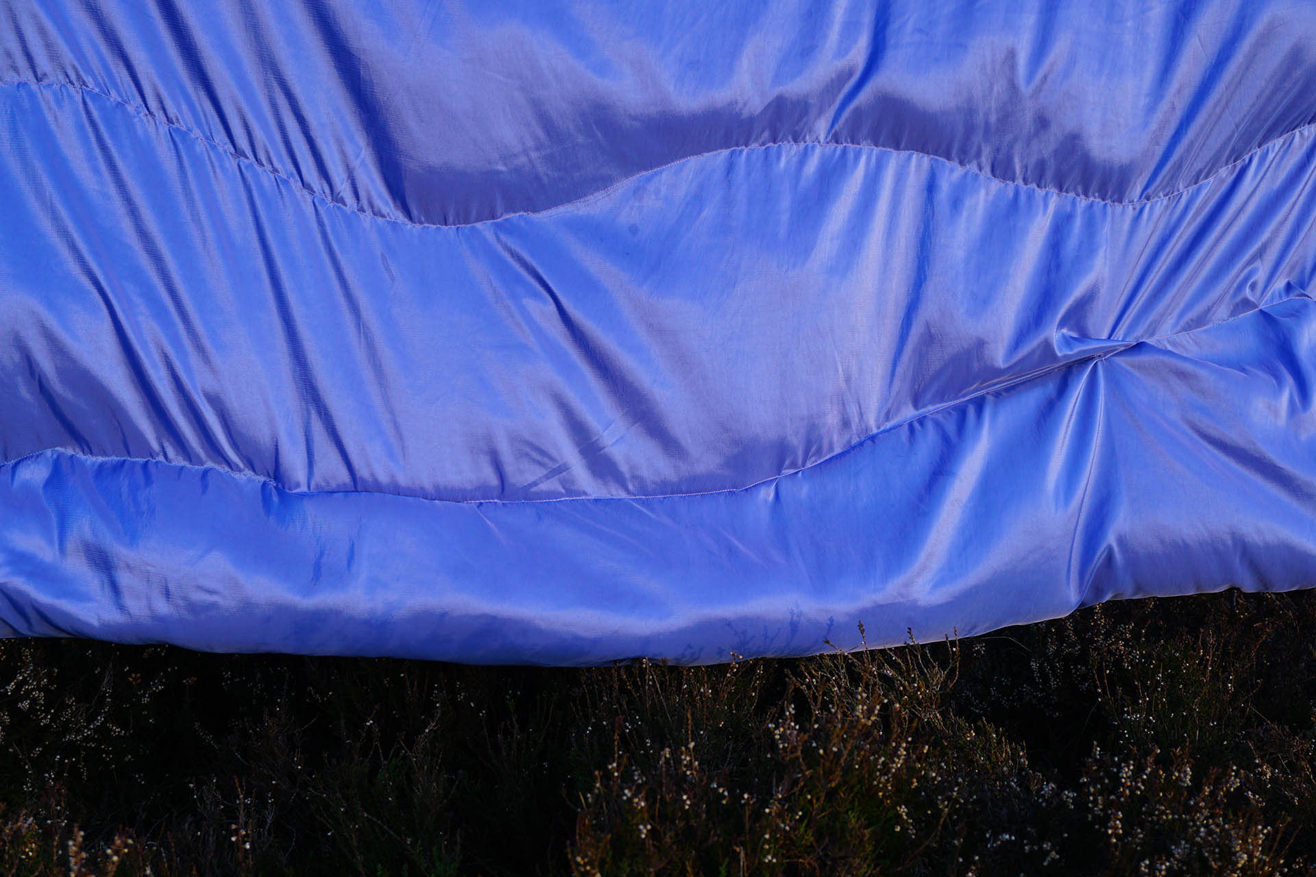close up of the two tone lilac stuffed taffeta in this you can see the stitching and stuffing clearly 