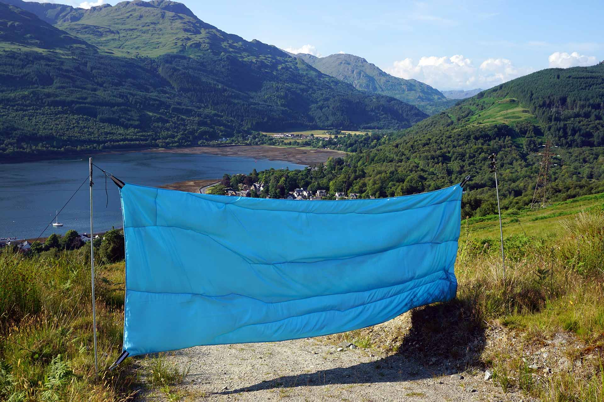 Baby Blue two toned taffeta sheet, obstructing a path over looking Loch Long and the Arrochar Alps