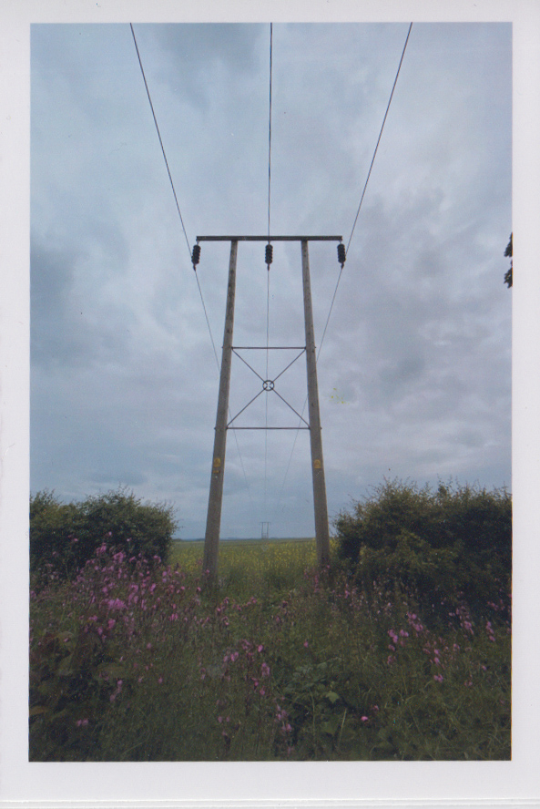 A central image of telephone wires - off setting, and odd.
