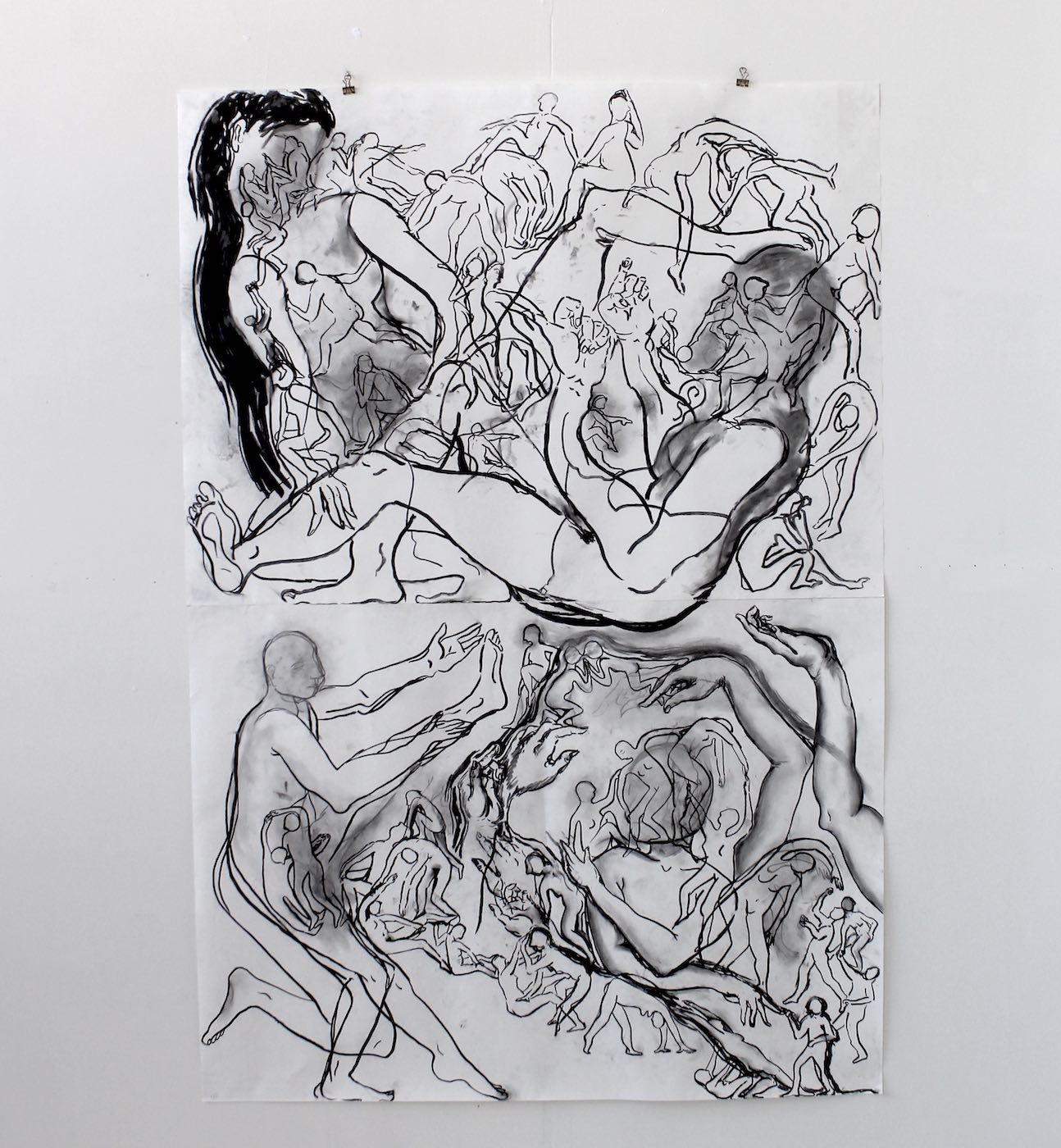 charcoal drawing hung on wall depicting large people with small lines of characters crawing all over them