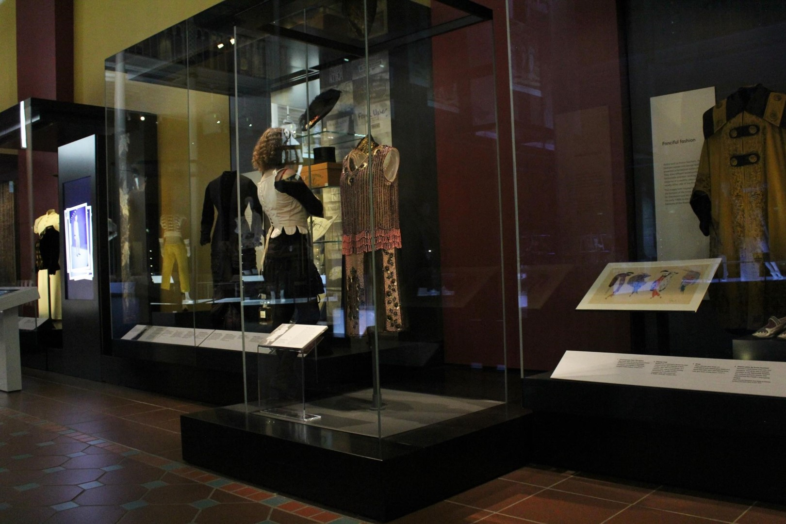 A person standing in a museum wearing a corset