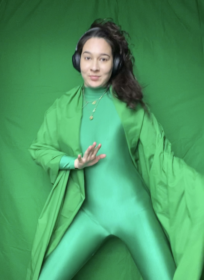 eva wearing a green suit