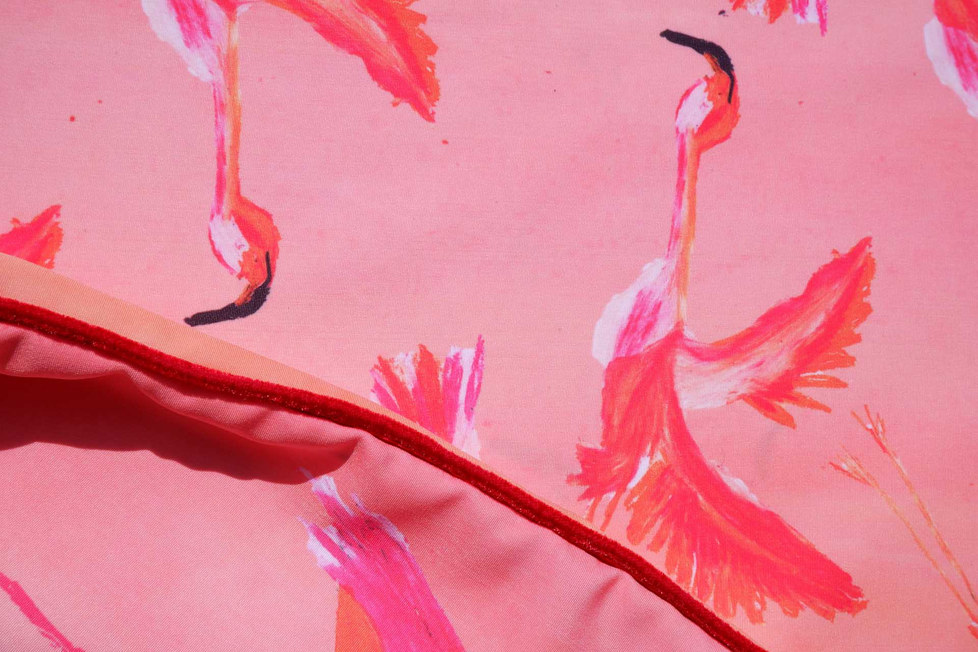 reverse quilt design showing illustrated flying flamingoes