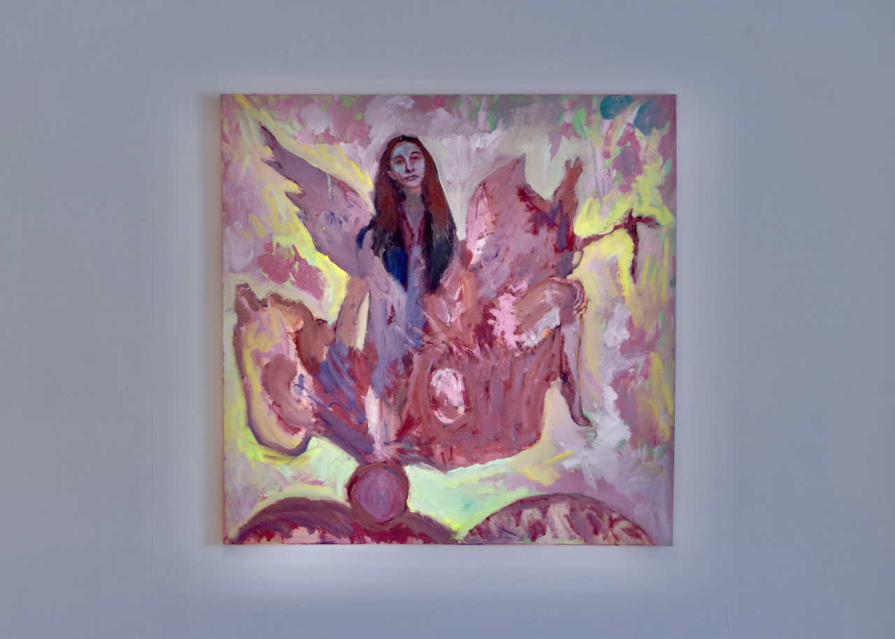 pink and yellow oil painting on wall depicting self portait of the artist as a mythological winged creature coming out of a vessel and birthing an egg