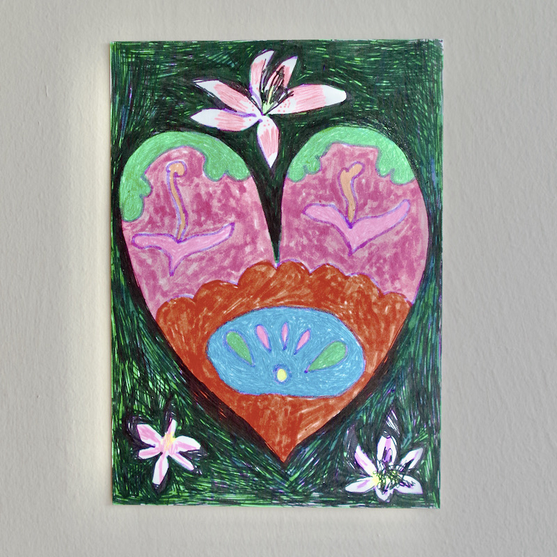 multicoloured love heart with lilies surrounding 