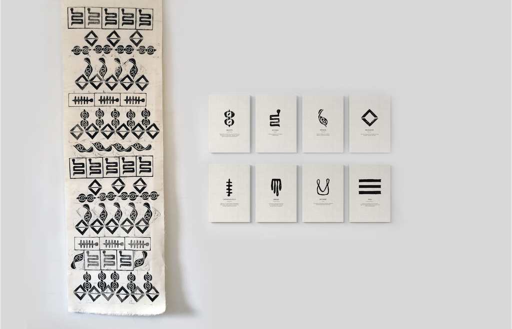 Exhibition display of a hanging textile print with eight accompanying canvas prints translating the pattern of the textile. 