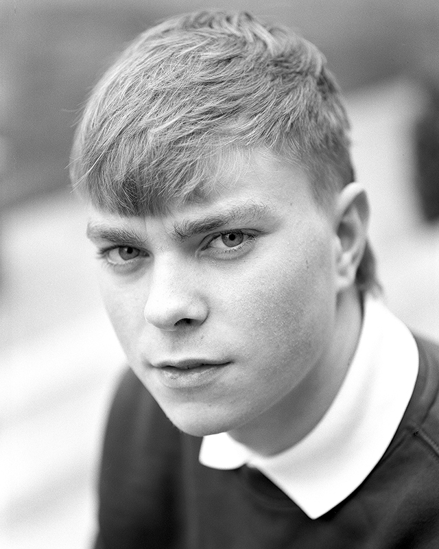 Portrait of a teenage boy in black and white