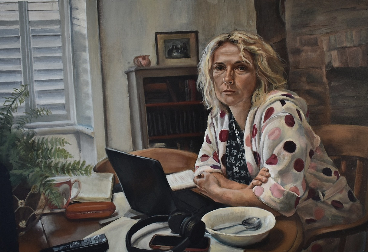 A lady sat at the dining room table that has now turned into an office desk, with a phone, cereal bowl and headset upon it.  A window behind on the left of the figure shines light onto her face, tired and frustrated, that is staring towards the viewer.